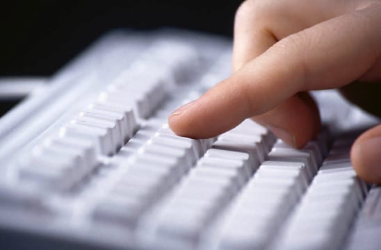 hands typing on key board